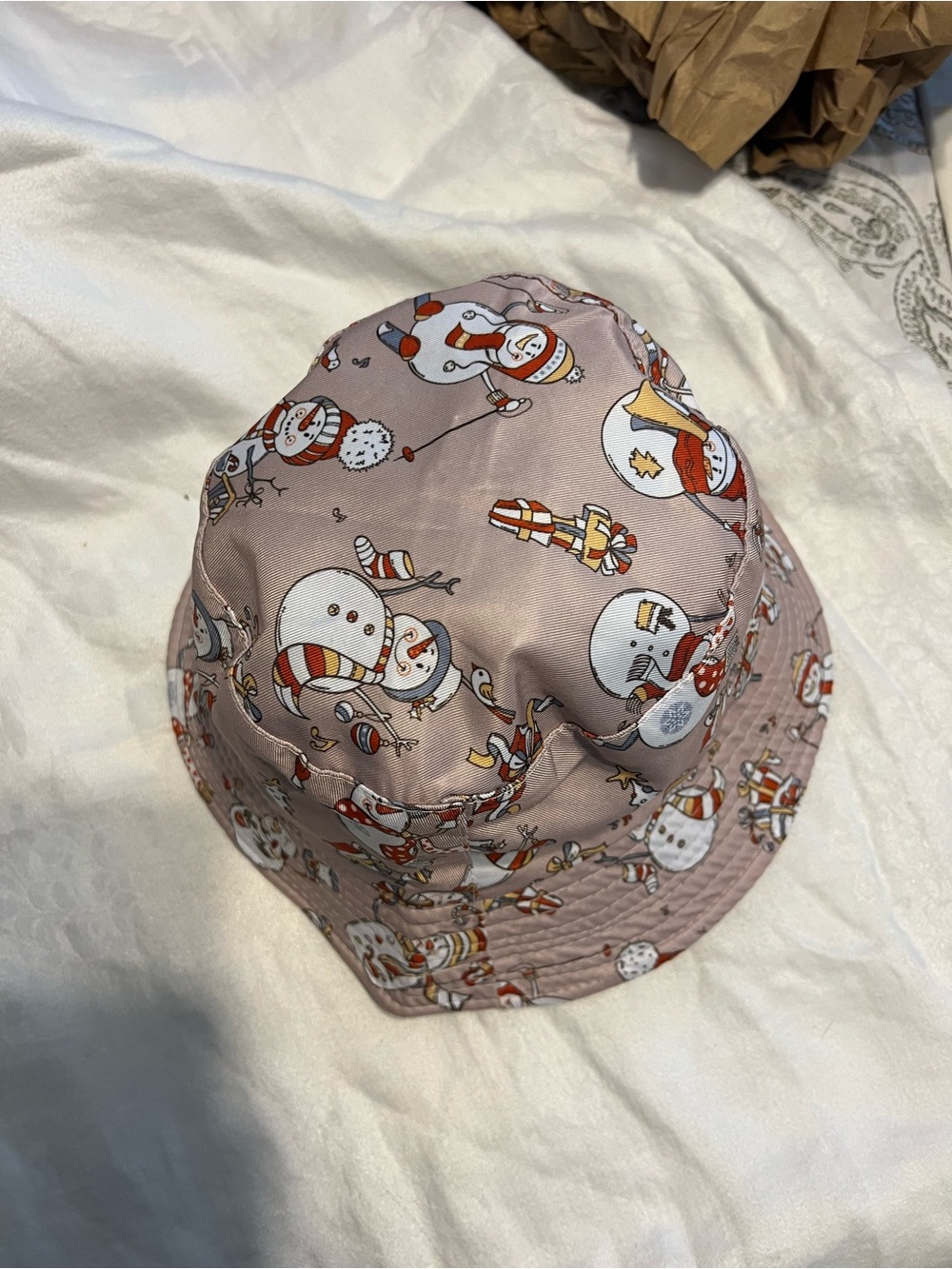 Kids Snowman Print Bucket Hat - Pink and reversible to a black side.